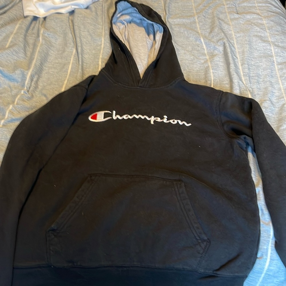 Black Champion hoodie. Size XL in kids.